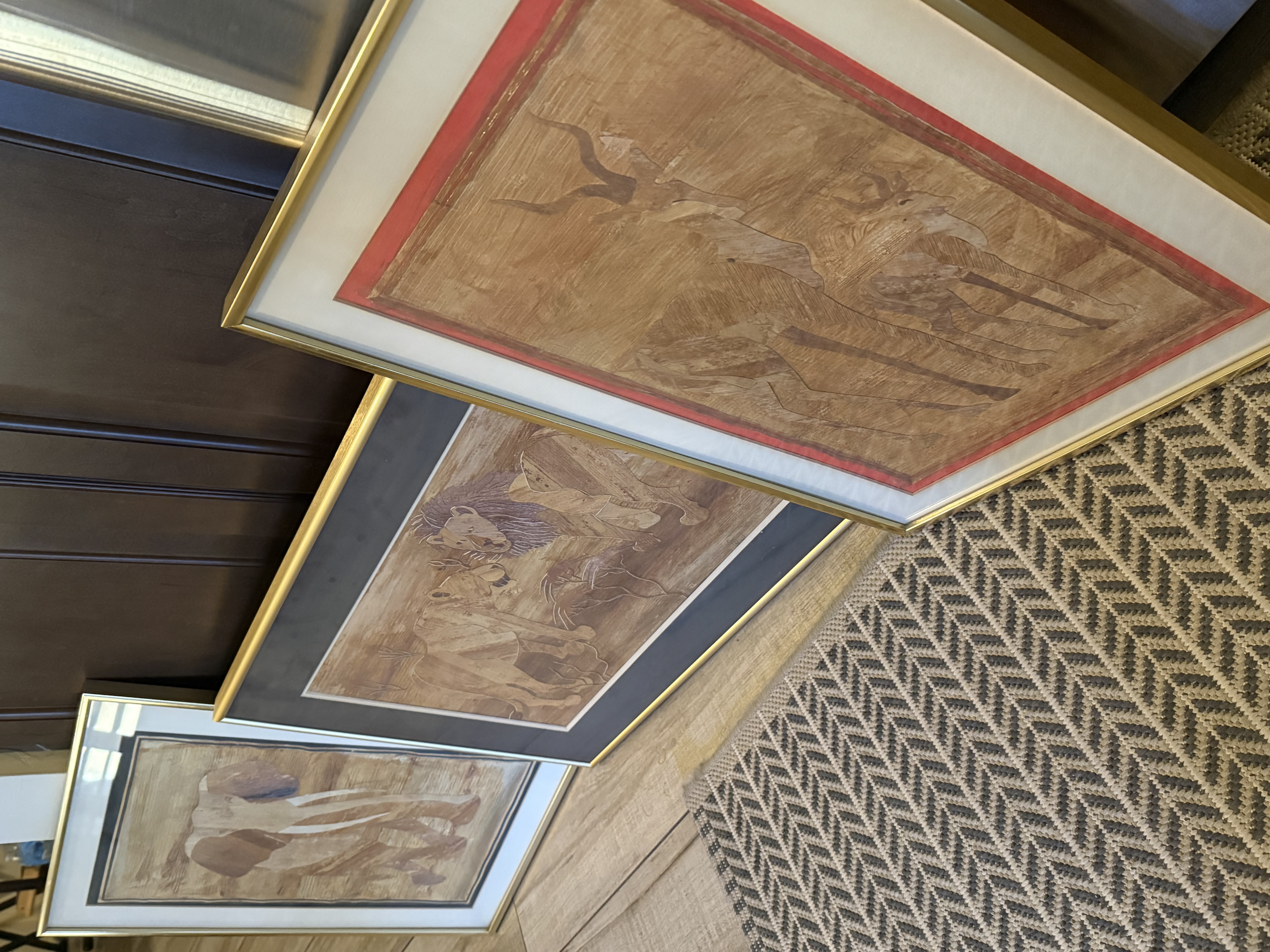 Three framed wood carved relief art panels